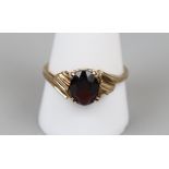 Gold garnet set ring (Size U)