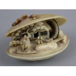 Carved Oriental clamshell ornament