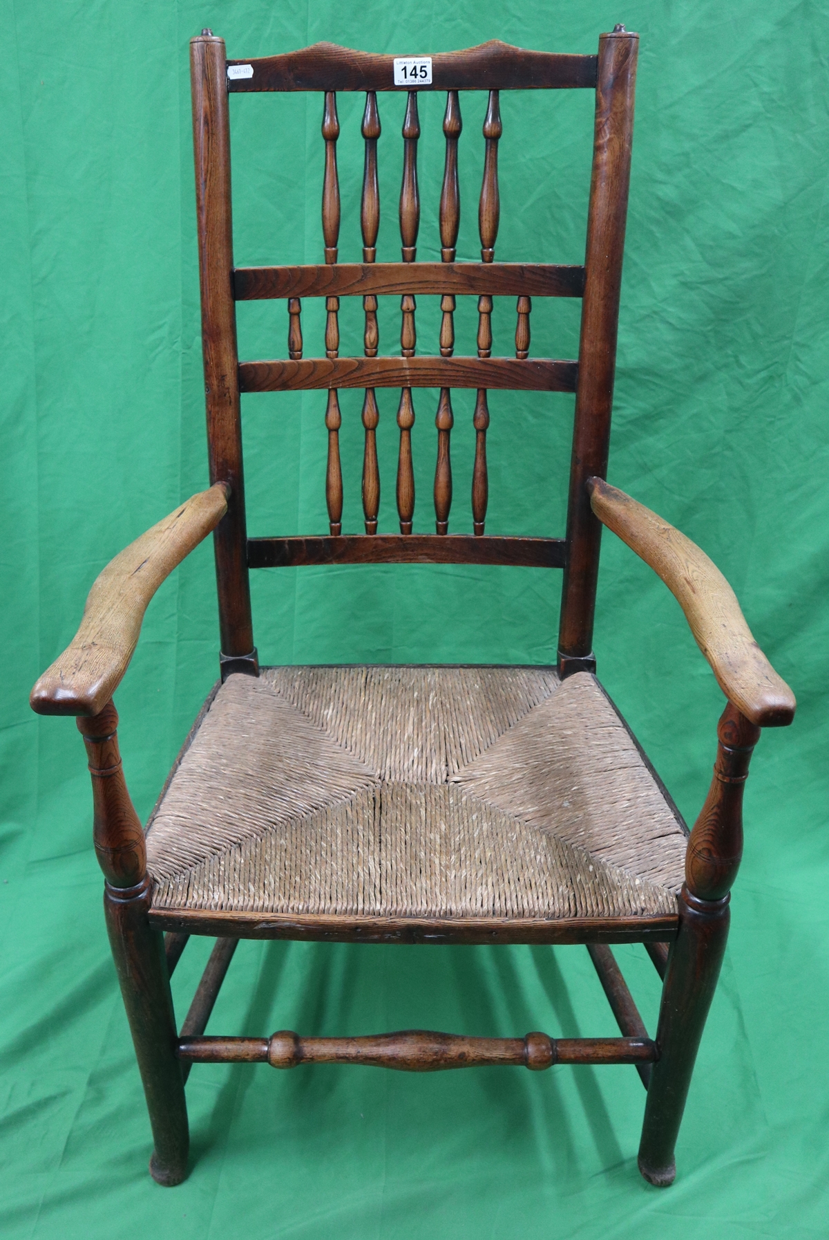 Antique rush seated armchair