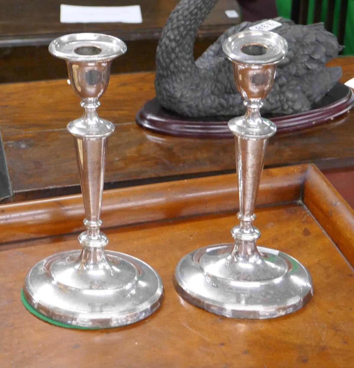 A pair of silver plate candlesticks