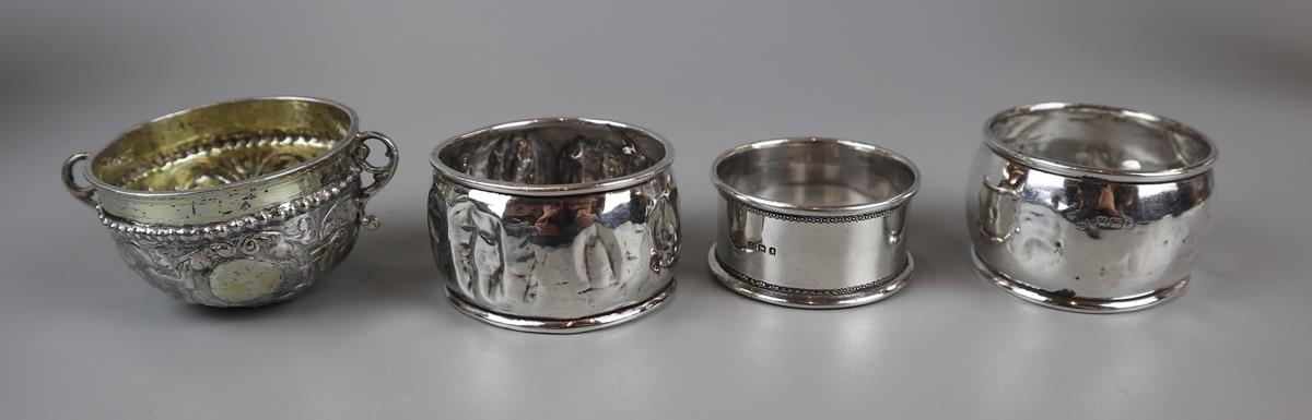 3 hallmarked silver napkin rings and white metal condiment pot