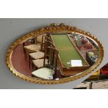Gilt framed bevelled glass oval mirror