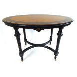 A late Victorian amboyna, ebony, ebonized and inlaid centre table,