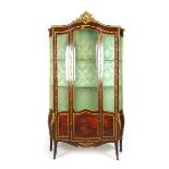 A late 19th century French kingwood and gilt metal mounted serpentine display cabinet,