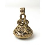 A 9ct yellow gold seal fob having an non-engraved smoky quartz stone set in an ornate mount.