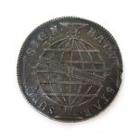 A Brazilian 960 Reis coin,