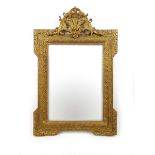 A 19th French century giltwood mirror with fleur de lis design to top,