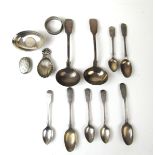 An assortment of silver and white metal items to include soup ladles, vesta case, caddy spoon,