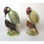 A Beswick model of a Green Woodpecker on a floral base (No.