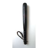 A Victorian ebonized police truncheon having the initials 'V.R' over crown, l. 37.
