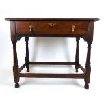 An 18th century and later oak side table, the moulded top over a single drawer on turned legs, h.