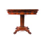 An early 19th century mahogany tea table,