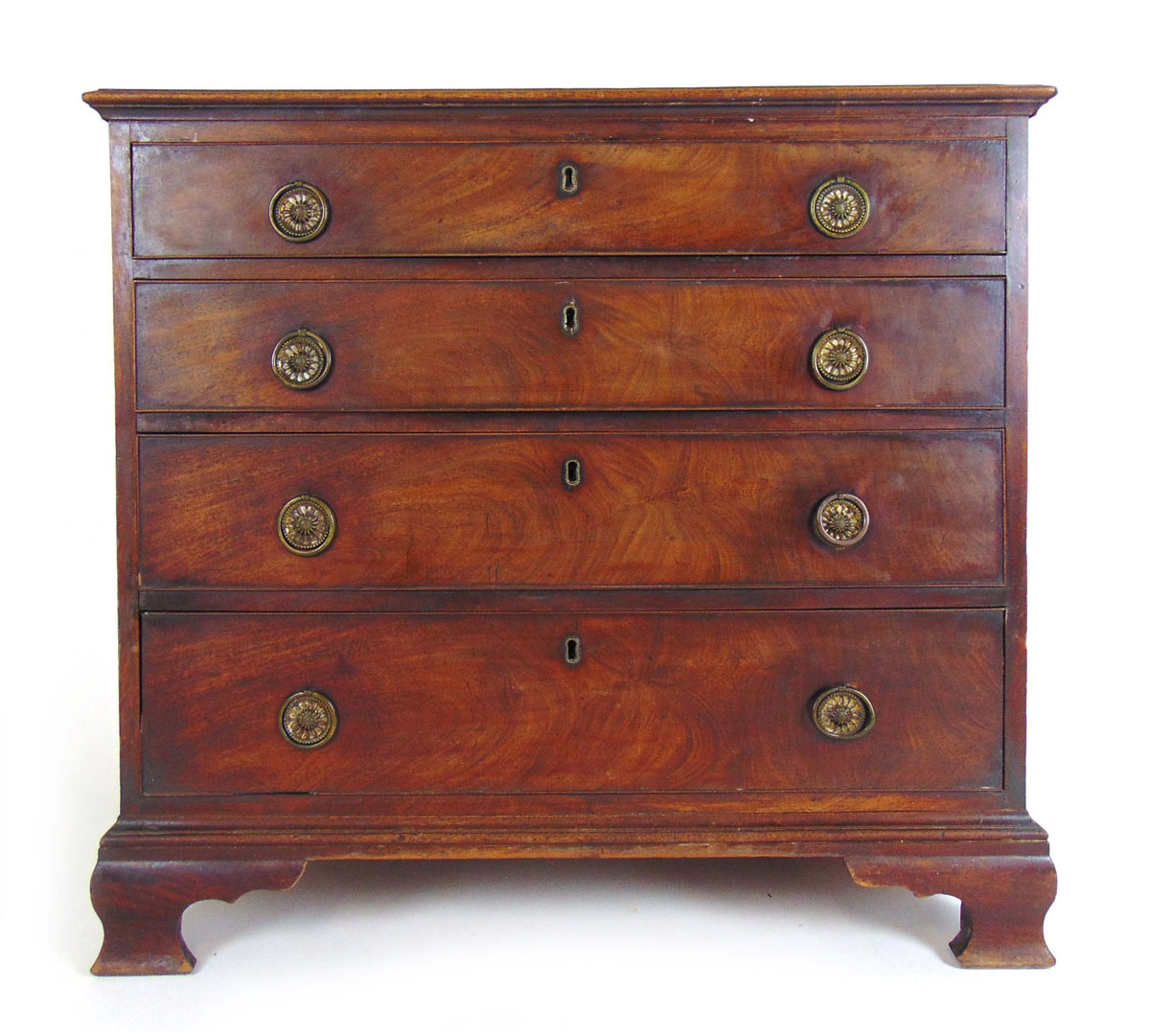 A George III mahogany dressing chest of four long drawers on ogee bracket feet,