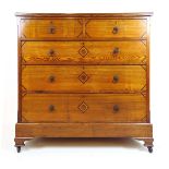 A late 19th century ash and inlaid chest of two short over three long drawers on ogee bracket feet,