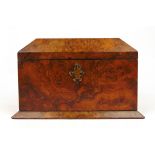 A Victorian burr walnut tea caddy, the top lifting to reveal two compartments,