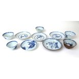 A collection of five 18th century Chinese export Nanking Cargo tea bowls and saucers decorated with