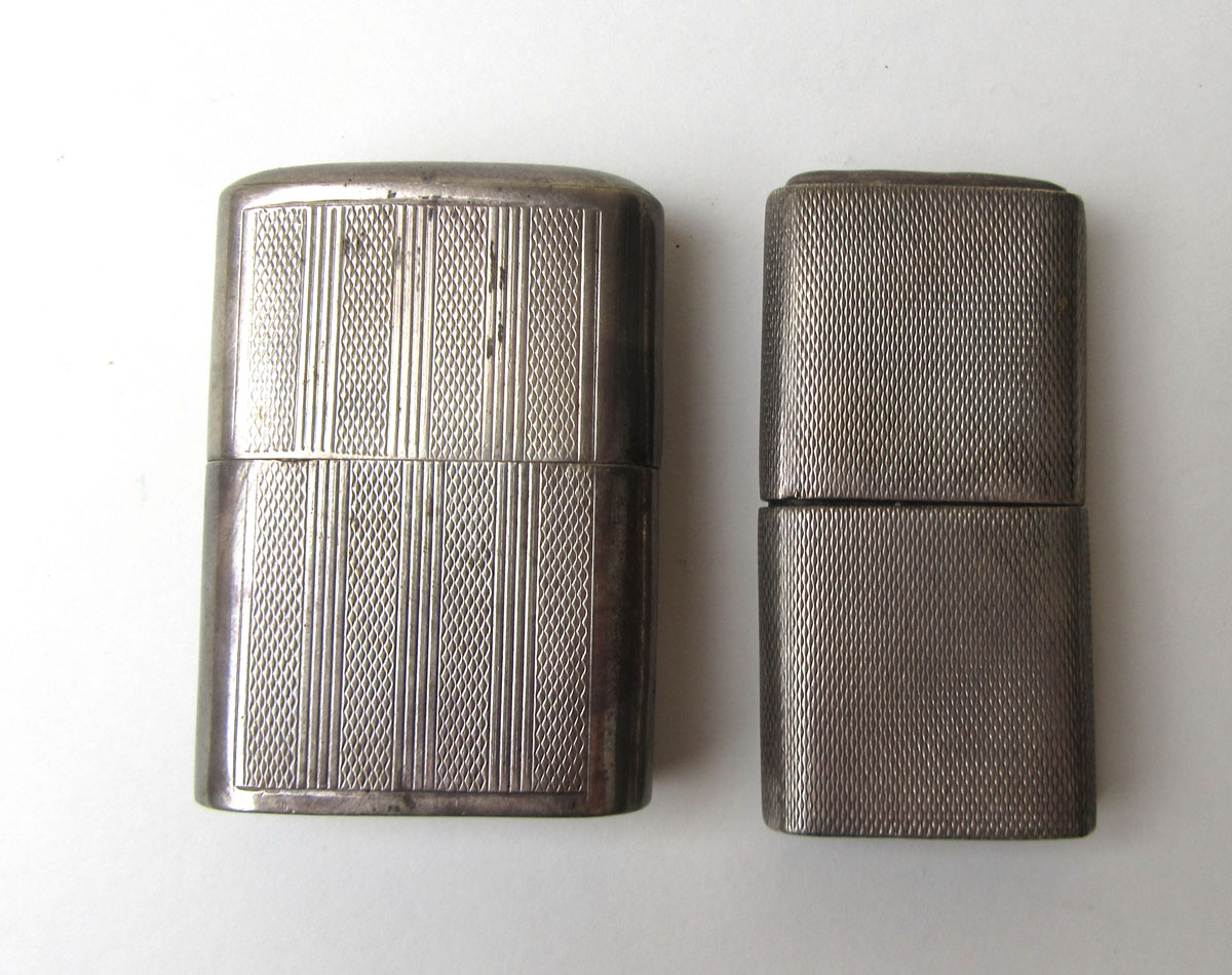 A silver 'The Howitt Lighter' together with one other silver hallmarked lighter, l.