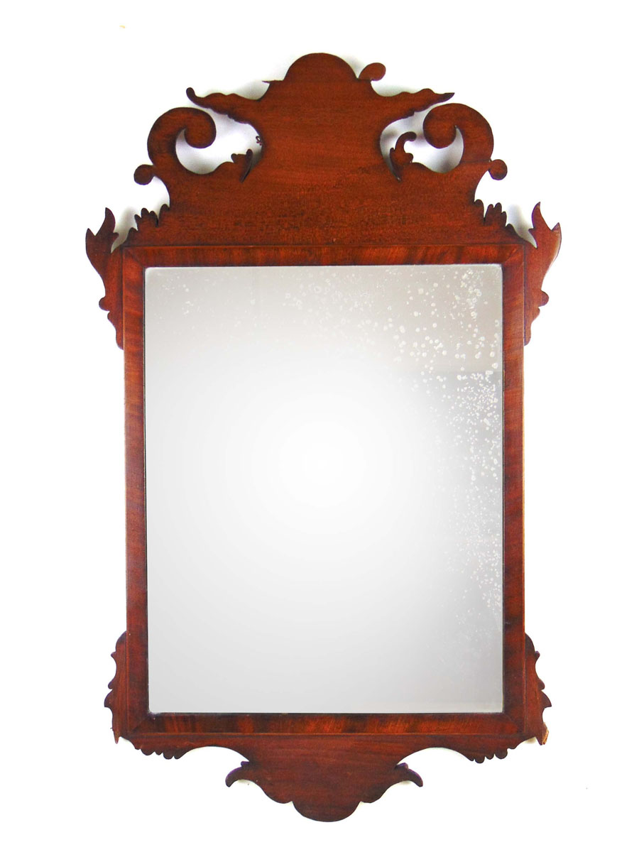 A mid 18th century mahogany fret work mirror,