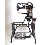 A Singer model No. 29 K 53 industrial leather work sewing machine on treadle base, h.