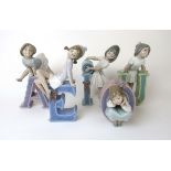 A set of Lladro schoolgirl vowels 'A', 'E', 'I', 'O' & 'U'.