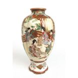 An early 20th century Japanese Satsuma vase of bulbous form decorated with people in garden and