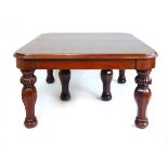 A Victorian mahogany extending dining table, the moulded top on six turned,
