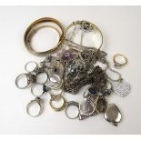 An assortment of silver, white metal and rolled gold jewellery to include bracelets, rings,