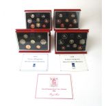 Four United Kingdom coin proof sets for the years 1986, 1988, 1991 and 1992.