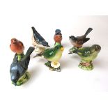 A collection of seven Beswick models of birds to include Nuthatch (No.2413), Robin (No.