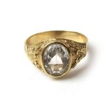 A gentleman's yellow metal ring set with a clear stone. Approx weight 4.7g. Size U.