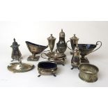 An assortment of silver cruet items to include shakers, open salts etc. Various hallmarks.