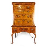 An early 18th century style walnut chest on stand,