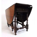 A late 17th / early 18th century walnut gateleg table,
