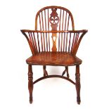 An early 19th century and later yew, elm and beech Windsor chair,
