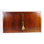 An early 19th century rosewood and boxwood strung wall hanging cabinet,