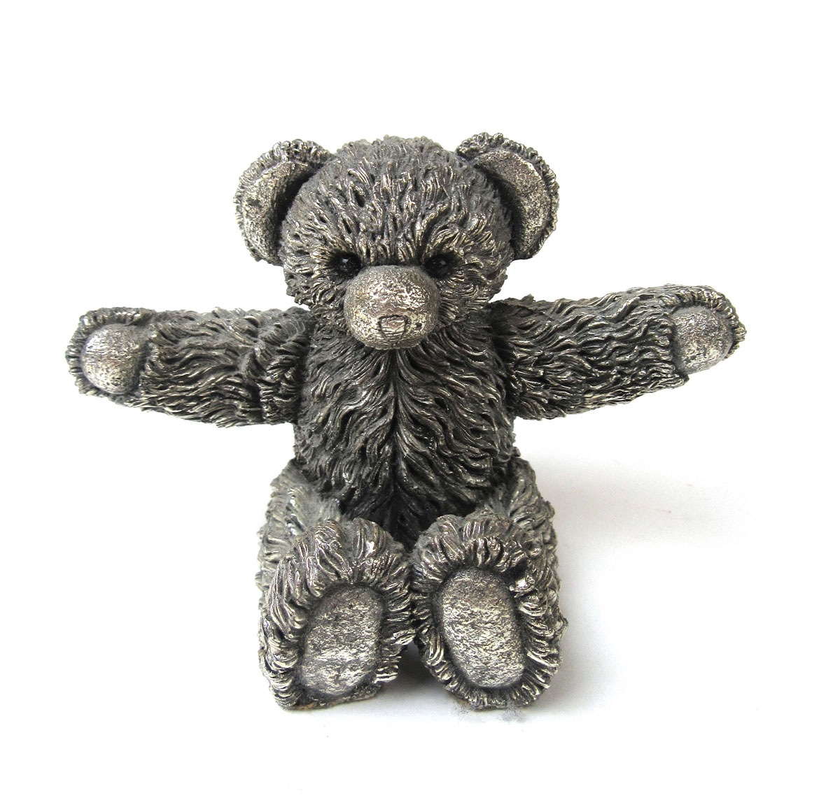 An Elizabeth II silver model of a Teddy Bear. Hallmarked for Birmingham 1995. Filled, h.