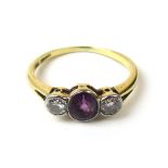 A yellow metal amethyst and diamond ring marked '18ct',