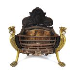 An 18th century cast iron and brass fire grate with lion head monopedia, h. 79 cm, w. 74 cm, d.