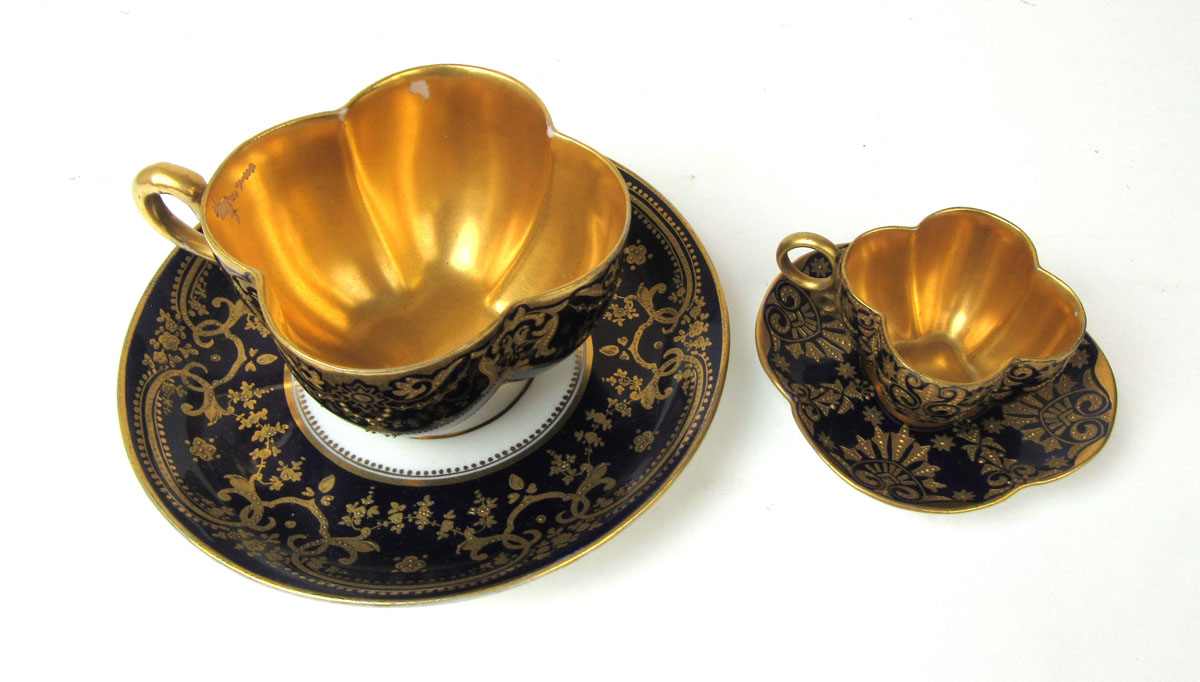 An early 20th century Coalport quatrefoil shaped cabinet cup and saucer having gilt decoration on a - Image 2 of 2