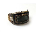 A Georgian yellow metal and black enamel mourning ring having glazed panel to front and inscription