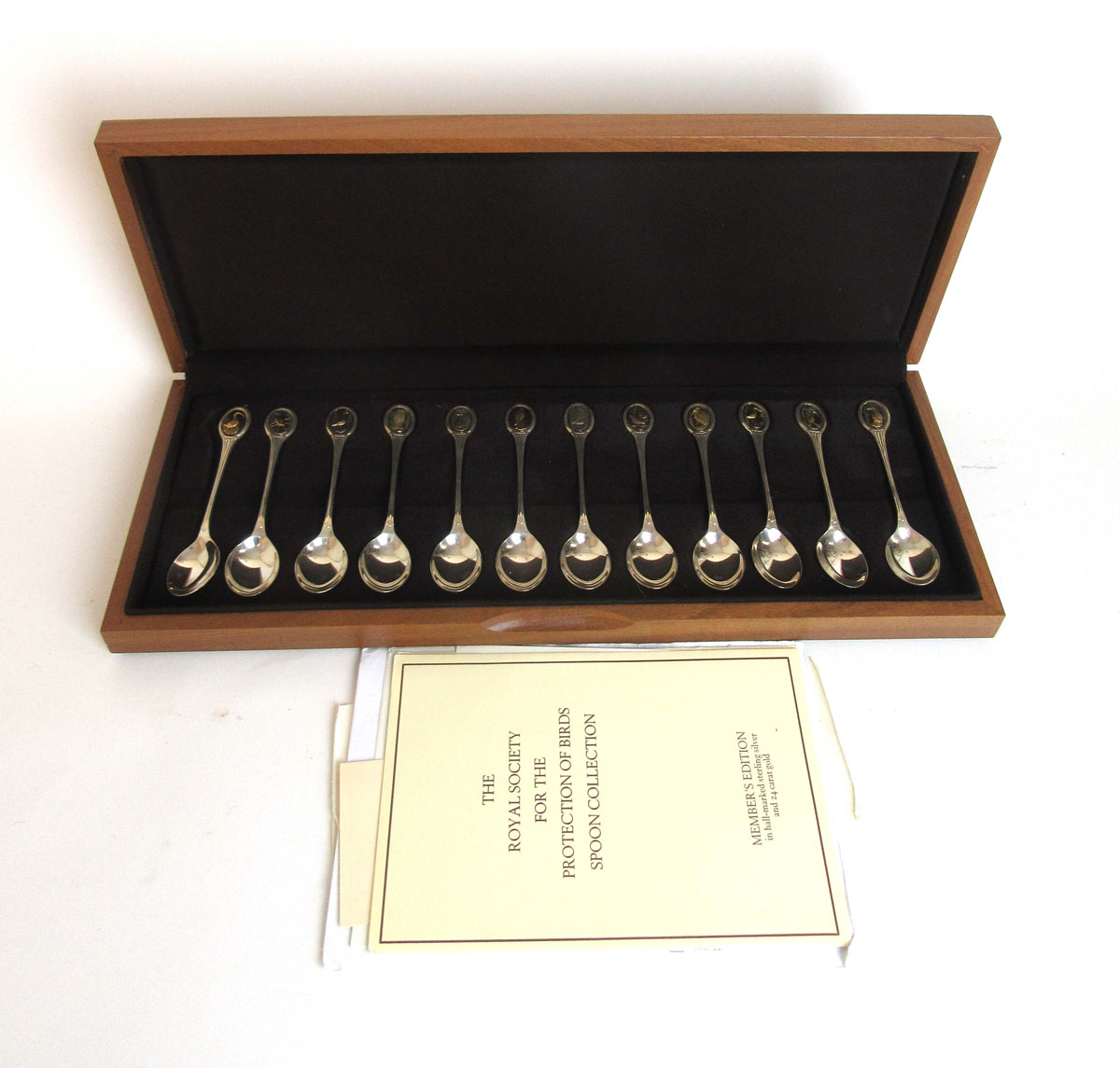 A set of twelve RSPB silver collector spoons having bird cameo finials.