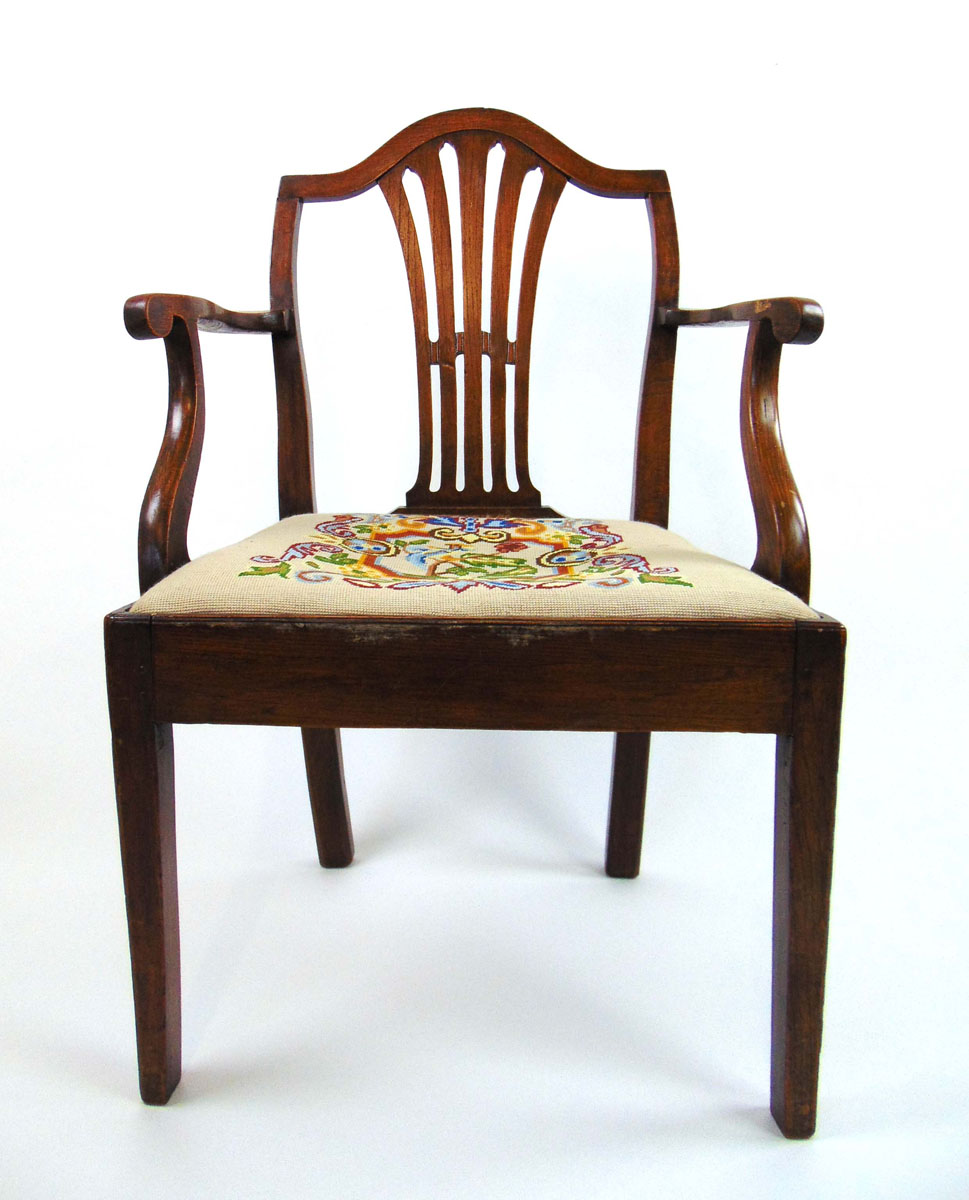 An 18th century elm open arm chair,