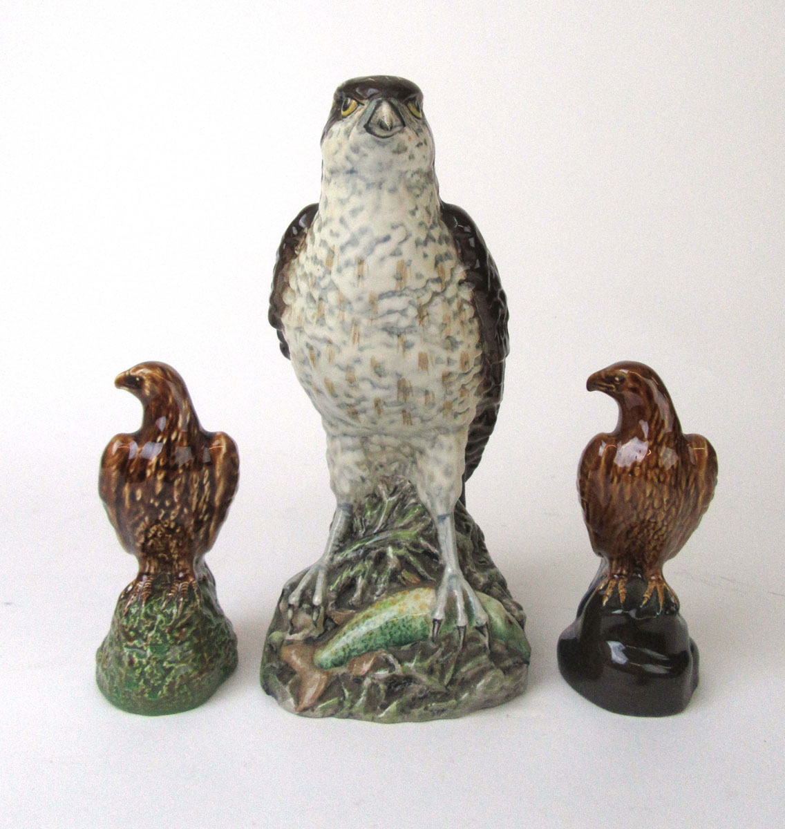 A Beswick Peter Thompson Osprey whisky bottle together with two miniature Beswick whisky bottles