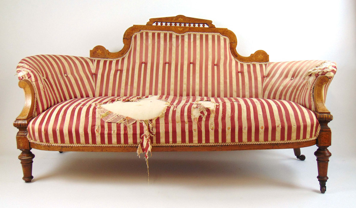 An Edwardian walnut, amboyna, boxwood strung and marquetry settee,