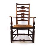 An early 19th century ash open armchair,