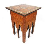 An early 20th century Islamic table, the square top with mother of pearl,