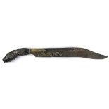 A 19th century Ceylonese Piha Kaetta knife, the fullered blade with scrolling decoration,