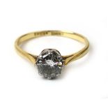 A mid-20th century 18ct gold and platinum diamond solitaire ring,