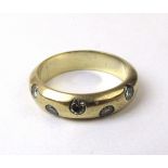 A yellow metal and diamond half eternity ring marked '750'.