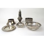 An assortment of silver and white metal items to include a George III silver sugar castor,